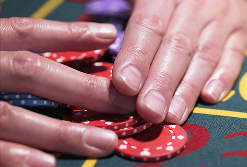 getty_rf_photo_of_hands_gathering_roulette_chips