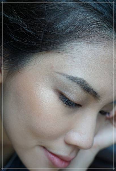 ofra highlighter everglow on face.jpg