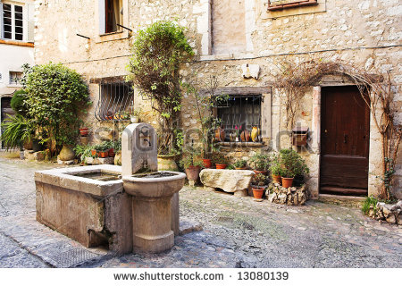 stock-photo-fresh-water-fountain-in-the-centre-of-the-quaint-little-french-hilltop-village-of-saint-paul-de-13080139.jpg