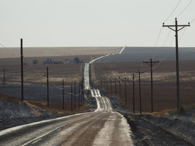 104736-FB~Telephone-Poles-Line-a-Dirt-Road-That-Extends-to-the-Horizon-Posters.jpg