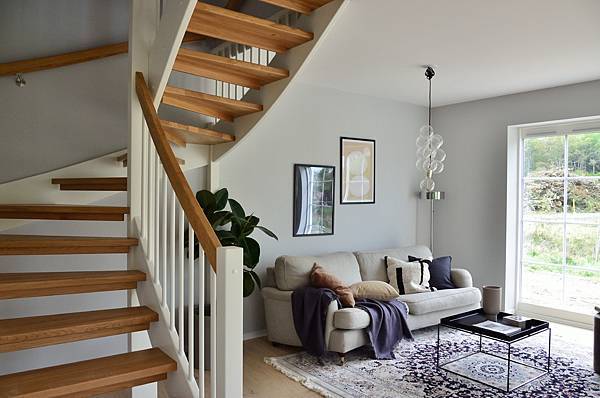 white-sofa-beside-brown-wooden-staircase-3705529.jpg