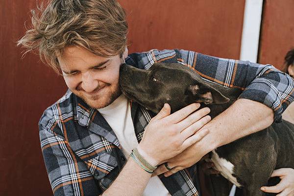 man-with-his-pit-bull-terrier-dog_53876-63329.jpg