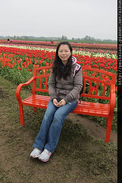 It's me in front of red flowers.