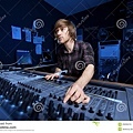 man-using-sound-mixing-desk-29295210