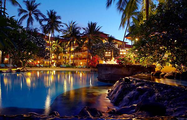The expansive lagoon and lush tropical garden at dust The expansive lagoon and lush tropical garden at dust