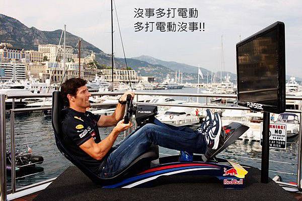 rk Webber of Australia and Red Bull Racing tries his hand on a computer game during previews to the Monaco Formula One Grand Prix at the Monte Carlo Circuit.jpg