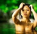 7231359-beautiful-naked-asian-woman-rises-up-out-of-water.jpg