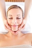 8376155-happy-woman-receiving-a-head-massage-in-a-spa-centre.jpg