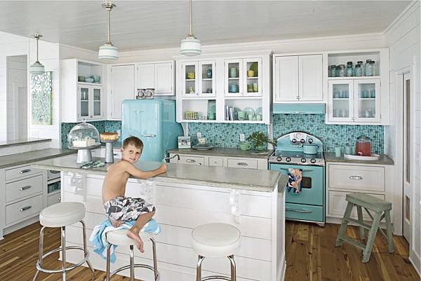 Bright-kitchen-with-a-retro-fridge-stove-and-a-matching-backdrop.jpeg