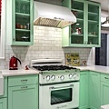 A-bold-mint-green-kitchen-in-combination-with-a-retro-stove.jpeg