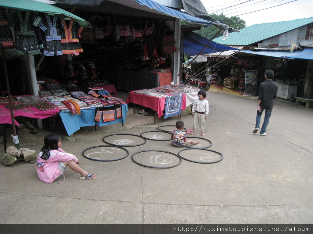 Mong tribe village kids in front of the store