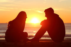 friends-couple-teens-facing-sunset-side-view-full-body-two-silhouette-beach-sun-middle-76485092.jpg