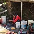 Women in village washing clothes in kuwa