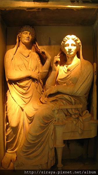 tomb stone. A scene of the living waving goodbye to the deceased.