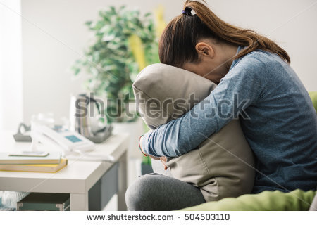 stock-photo-unhappy-lonely-depressed-woman-at-home-she-is-sitting-on-the-couch-and-hiding-her-face-on-a-pillow-504503110.jpg