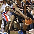 Pistons guard Will Bynum tries to swat the ball from Atlanta Hawks guard Richard Delk in the first half at The Palace of Auburn Hills on Monday, Oct. 11, 2010..jpg