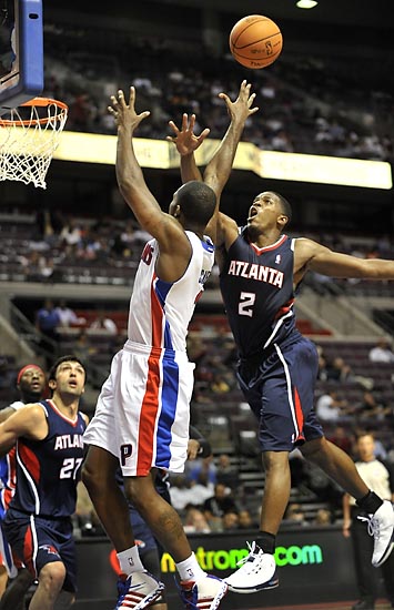 Hawks guard Joe Johnson defends a drive by Rodney Stuckey in the third quarter..jpg