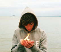 beach-boy-fire-hands-202090.jpg