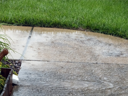 Gutter water from thunderstorm 06-12-2016.jpg