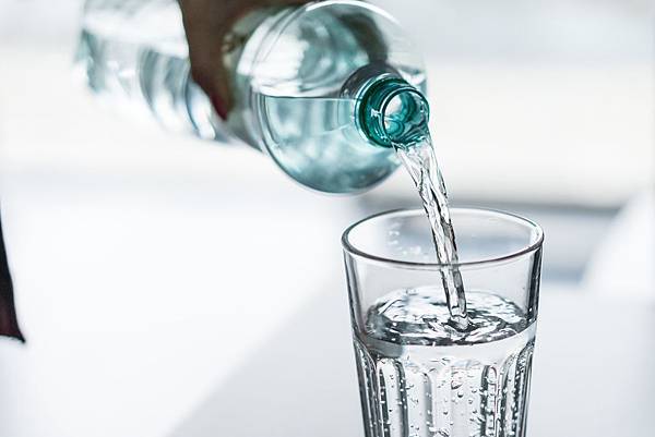 pouring-water-from-pet-bottle-into-a-glass-picjumbo-com.jpg