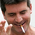 Simon-Cowell-enjoys-a-cigarette-as-he-meets-the-Press