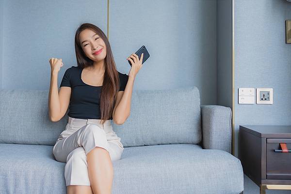 portrait-beautiful-young-asian-woman-use-smart-mobile-phone-sofa-living-room-area.jpg