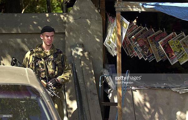 6th October, 2003. The day after Akhmad Kadyrov is elected President of the Chechen Republic. An MVD trooper stands guard..jpg