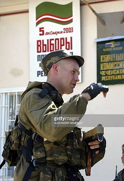 Grozny, 26th August, 2003. A Russian MVD spetsnaz on. patrol outside an electoral building..jpg