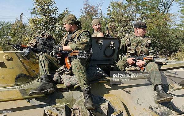 Grozny, 6th August, 2003. The day after Akhmad Kadyrov wins the Presidential election in the Chechen republic. OMON troops patrol the areas around Grozny..jpg