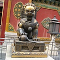 gold-copper lion in front of 神武 Gate