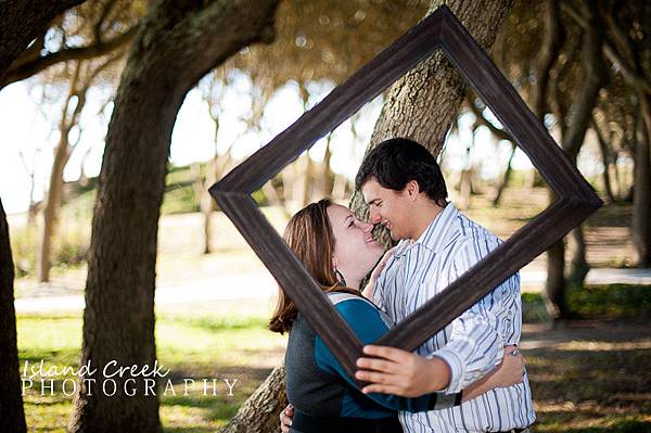 Using-props-during-engagement-sessions-prop-ideas-frame-engagement-photography-Fort-Fisher-NC.jpg