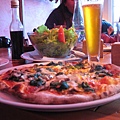 Pizza, salad, and beer (La Mesita Grande, Puerto Natales, Chile)