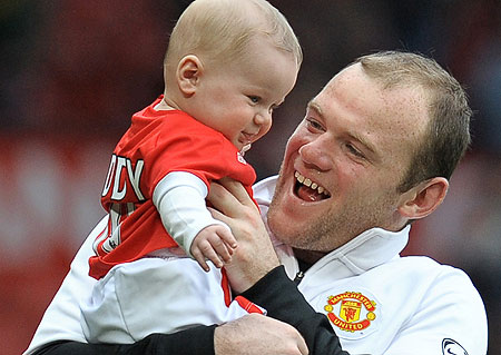 wayne-rooney-holding-his-son-kai.jpg