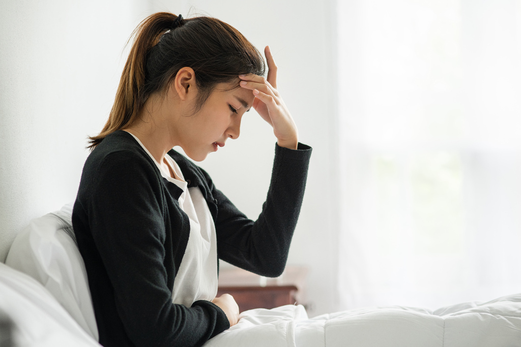 sick-woman-had-headache-hands-touched-her-head-bed.jpg