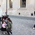 Carolina playing with a kid at Golden Lane, Prague Castle