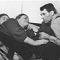 Henry Fonda (right) at the bedside of Shirley Mill (left) and Jane Darwell in a scene from the film The Grapes of Wrath