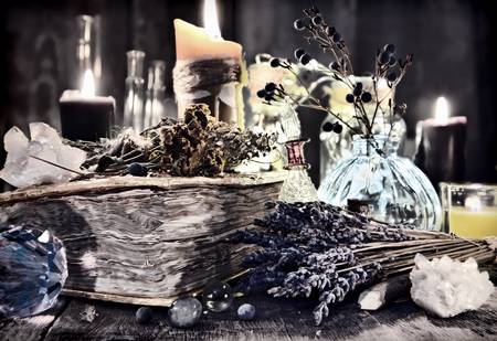 95807579-antique-witch-book-with-lavender-flowers-magic-ritual-objects-healing-herbs-crystal-and-black-candle.jpg