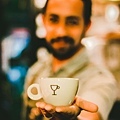 focus-photography-of-man-holding-ceramic-teacup-733761.jpg